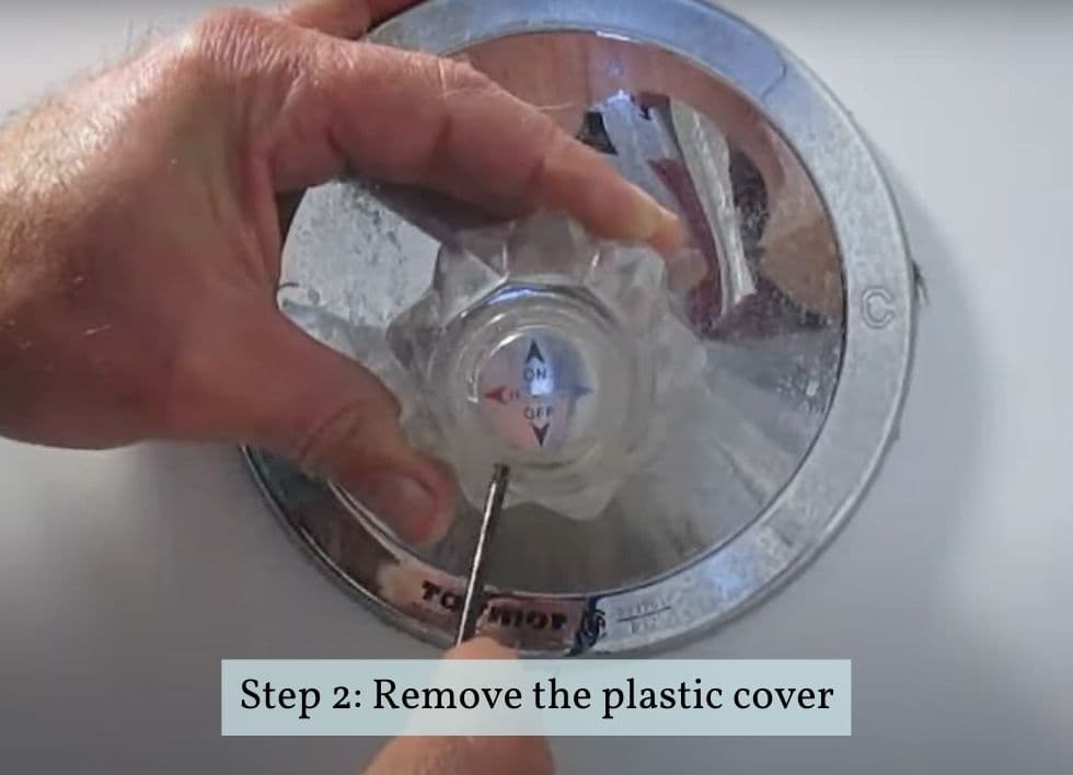 removing the plastic cover of bathtub lever handle