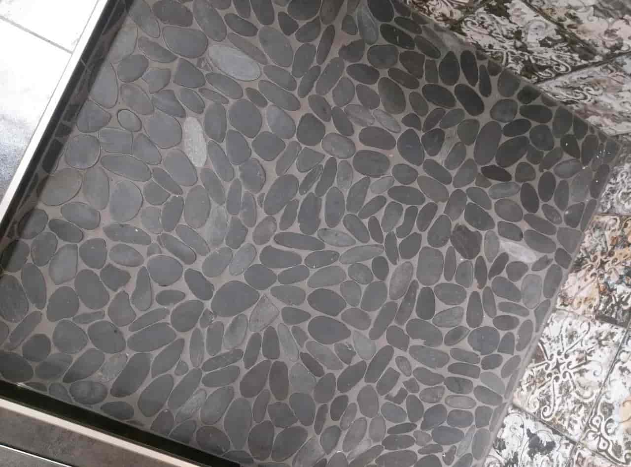 10 Common Pebble Tile Shower Floor Problems That Every Owner Feels