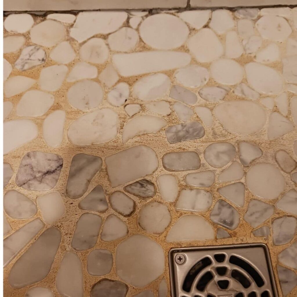 discolored image of pebble shower floor