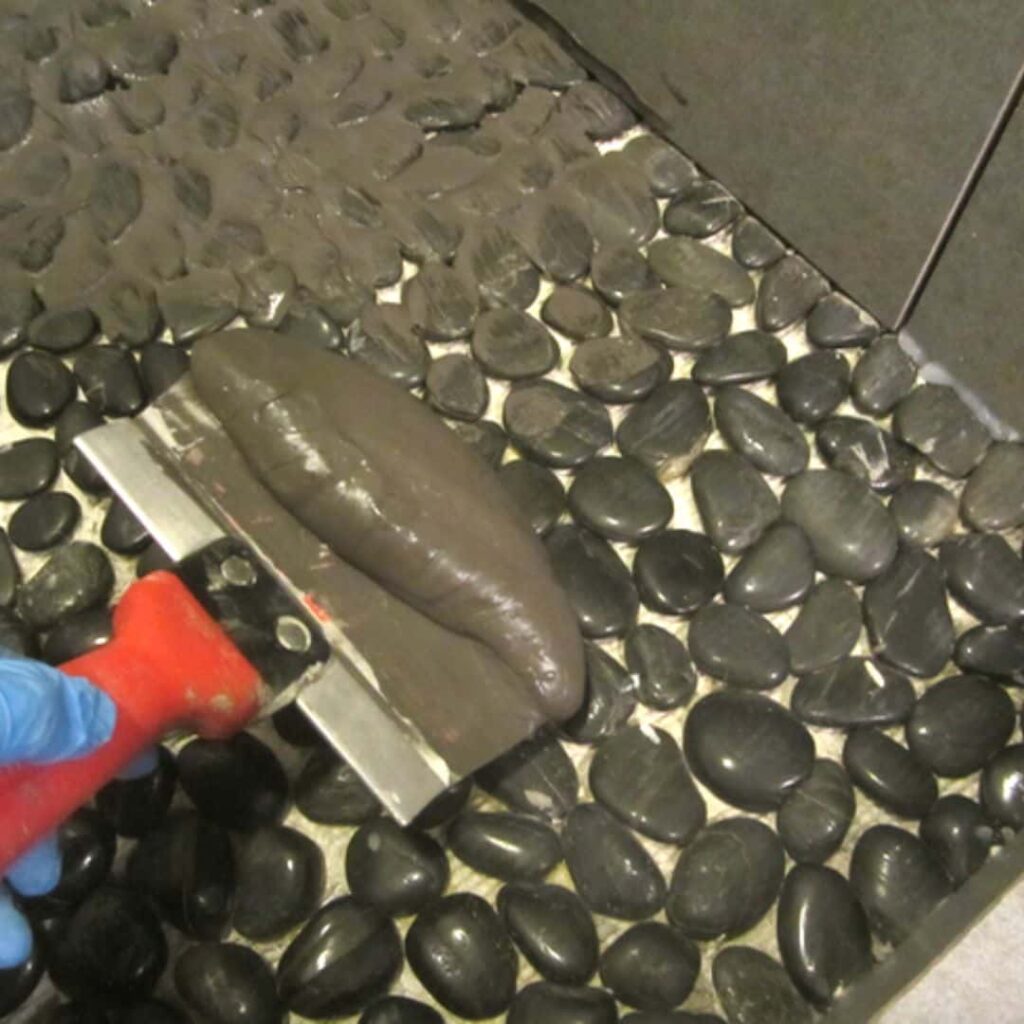 image showing excess grouting required on pebble floor