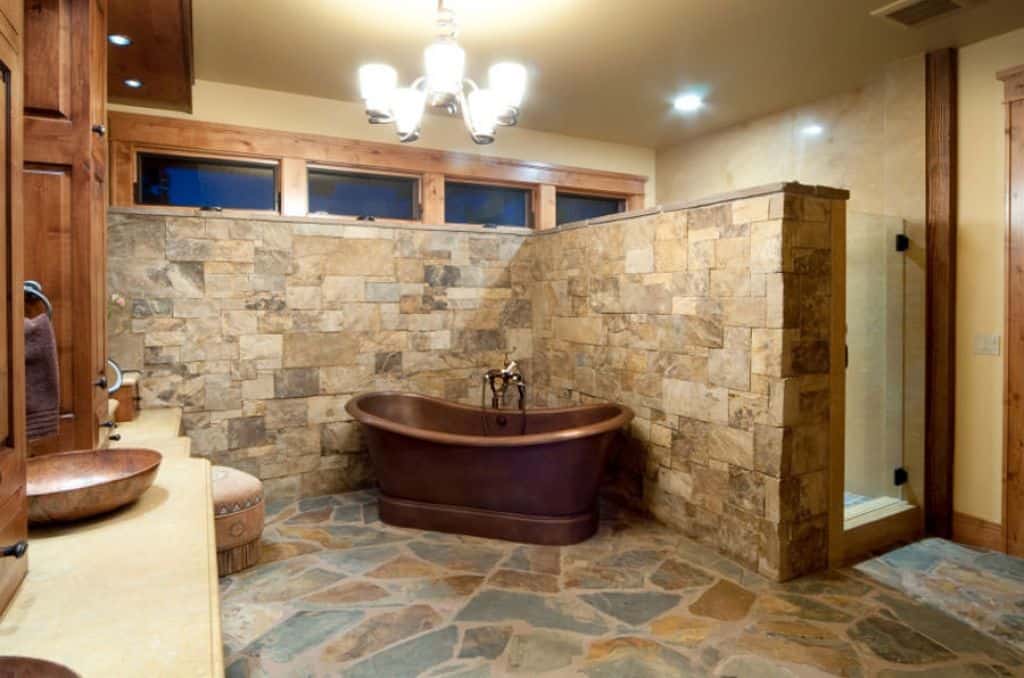 an image of stone floor in bathroom, similar to pebble floor