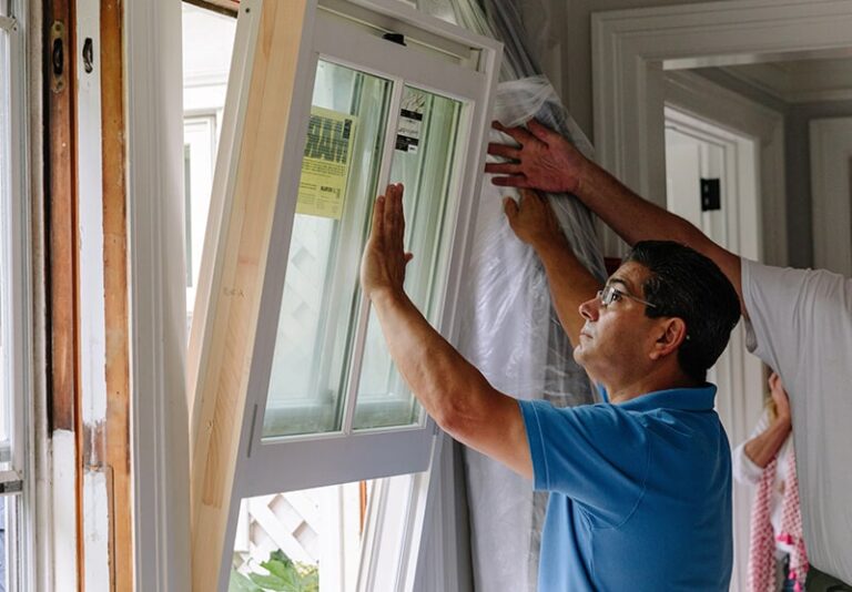 an image showing a person replacing outdoor windows