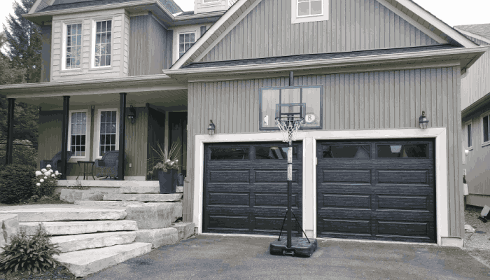 Gray house with black garage