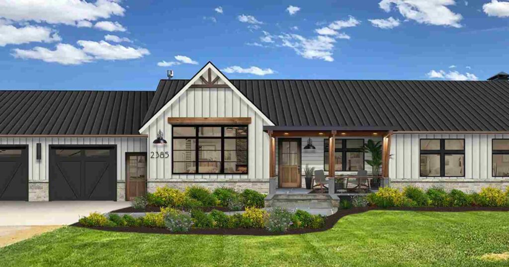 A black and white house and wooden pillars black framed windows and celling lights above on the wall and garden outside of the door