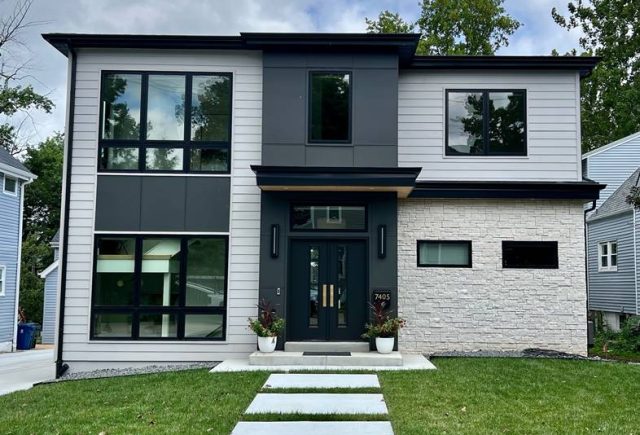 White stone and black house and stone pathway and glass window
