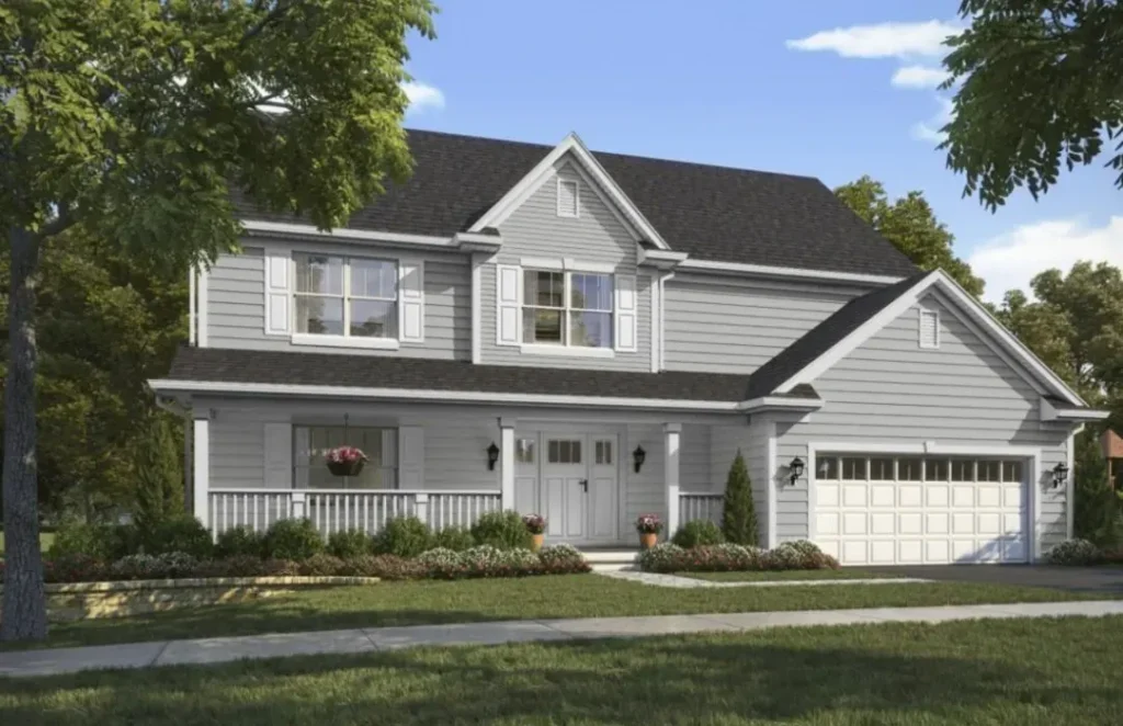 A black roof and gray house and white framed window and white front door