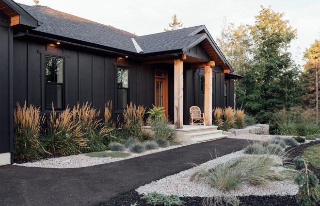 A log siding house and wooden pillars and glass window
