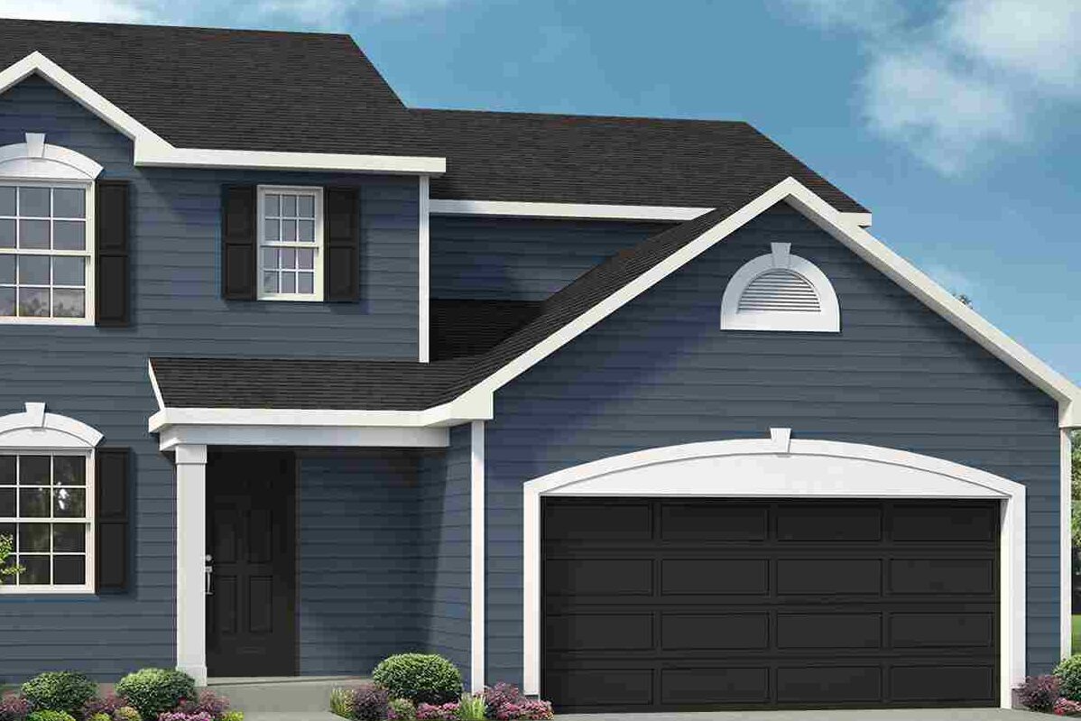 A blue house with white trim and black garage door and shutter