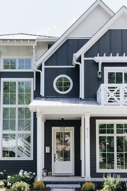 Blue house with white front door and white pillars