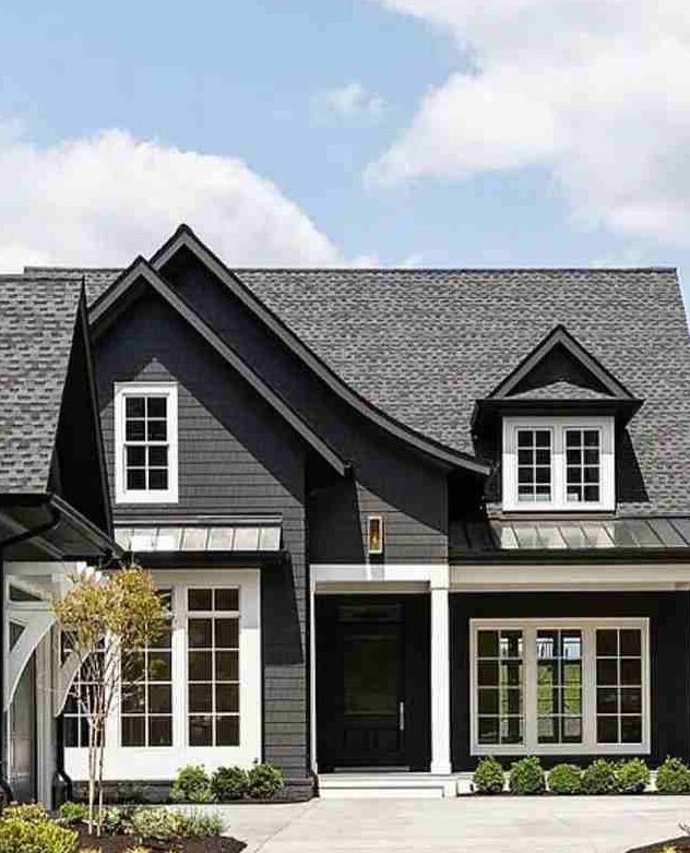A black house with white windows and black trim
