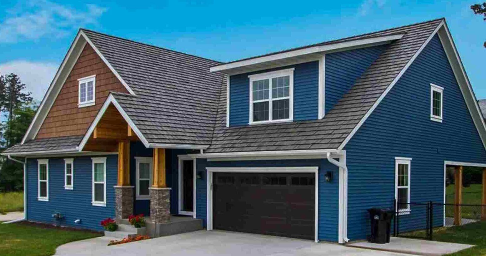 Dark blue house with wood sidling and white trim house
