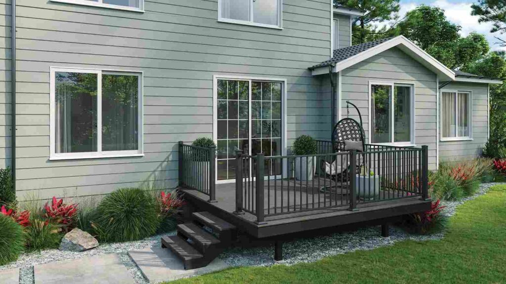 Green house with black porch and white trim windows