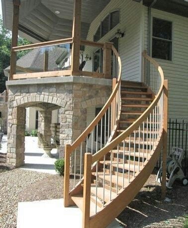 A white house with wooden stair and railings