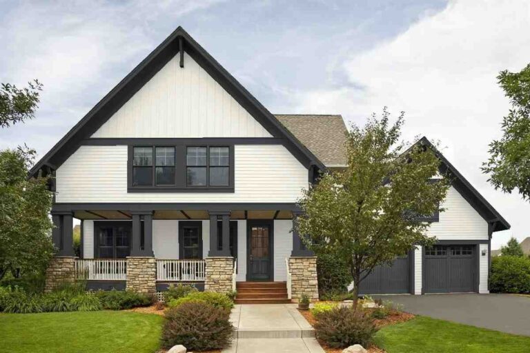 White house with black trim and wood accent featured image