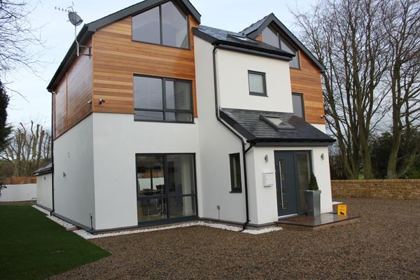 Wood cladding on white and black house and