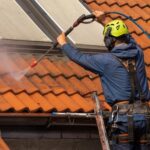 a person cleaning the roof