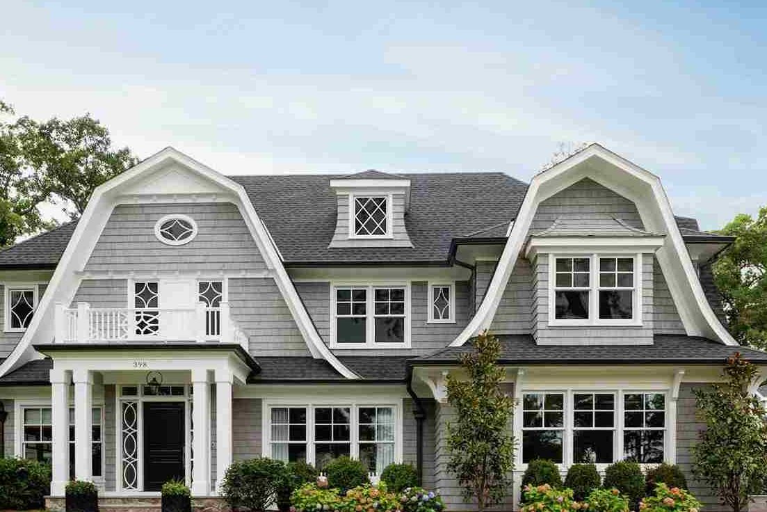 Light grey house with black trim and windows