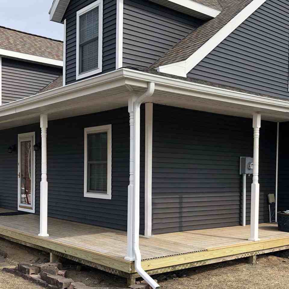 Black house and white gutter and white windows