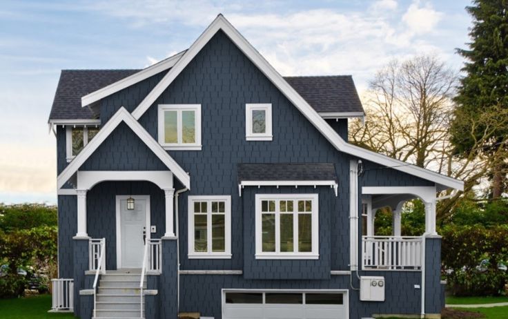 Blue house and white trim and white trim windows