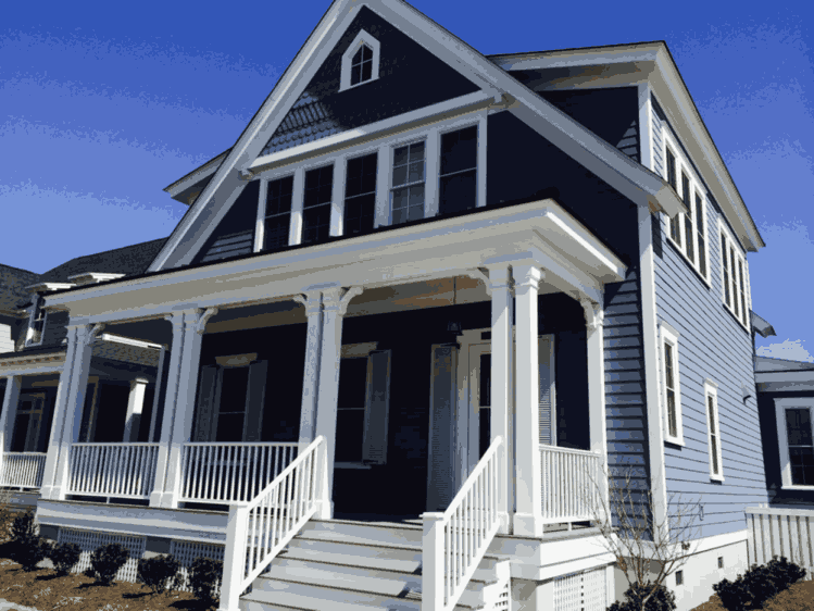Blue house with white railing and stair
