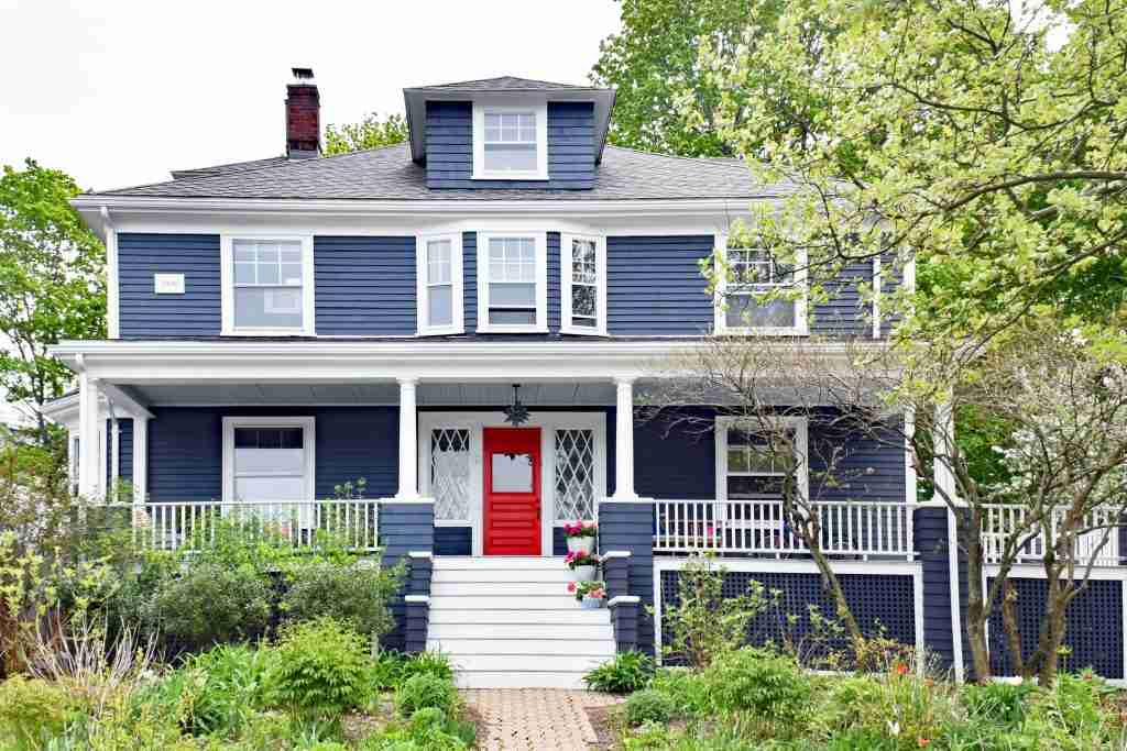 Blue house with white trim and red front door