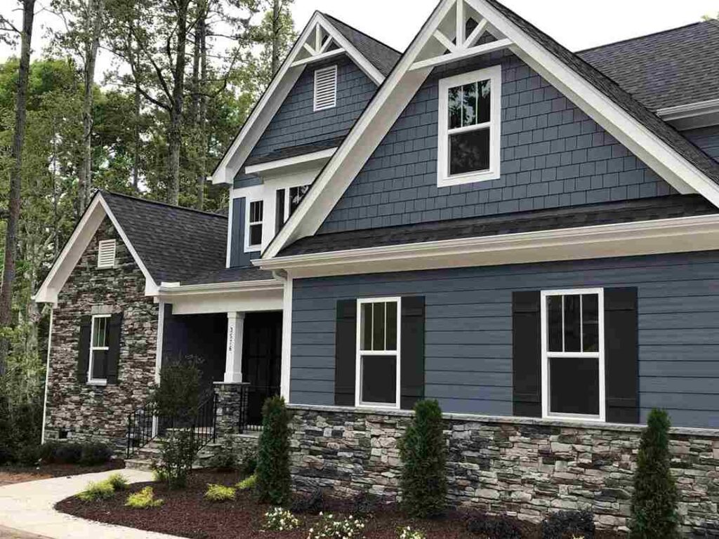 Blue house with white windows and black trim