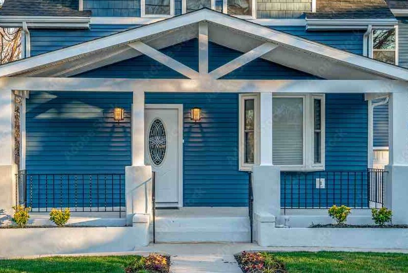 Blue sliding with blue house and gable roof