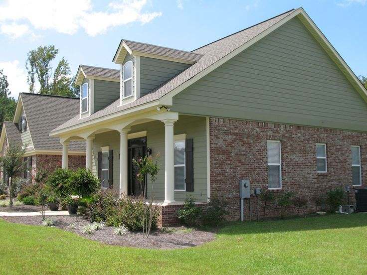 Red brick with sage green white windows