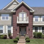 brick and siding house featured image