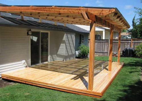 Cedar patio roof on grey house