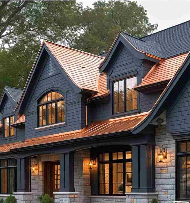 Blue house with copper awning and blue framed windows and lights on the wall