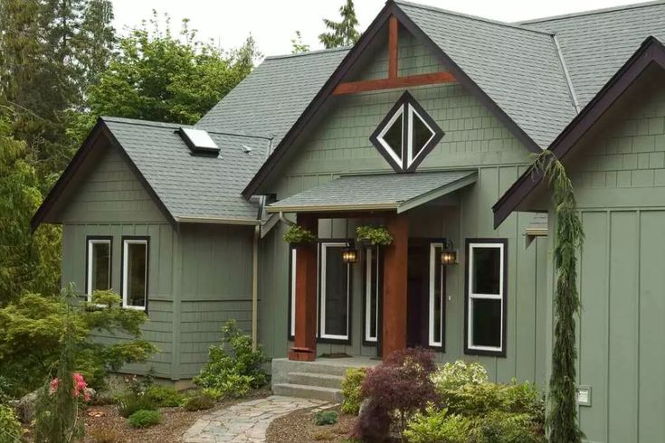 Dark and sage green with white framed window and wooden pillar 