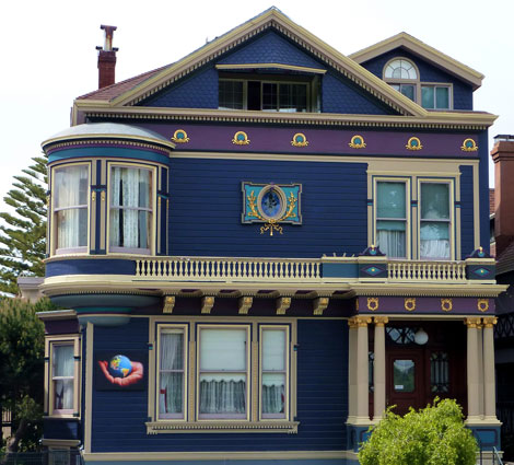 Dark blue house with purple tone and white trim