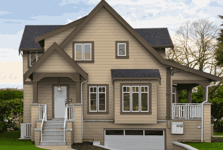 Tan house with dark brown trim and white framed windows and stair and railings