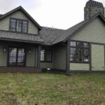 forest Green house with black trim featured image