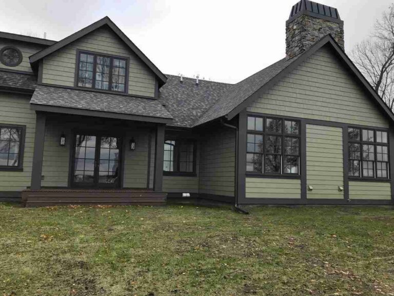 forest Green house with black trim featured image