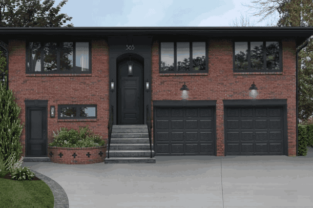 Black garage and red brick house and black framed glass window and celling lights above the wall