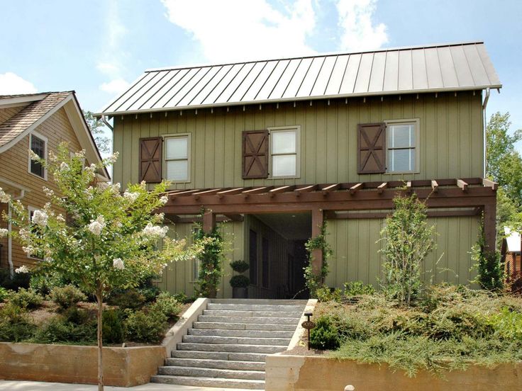 Wooden pergola on green house and wooden window with windows and stair