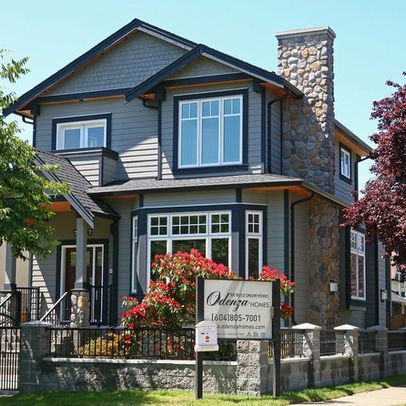 Grey house with black trim and white framed windows