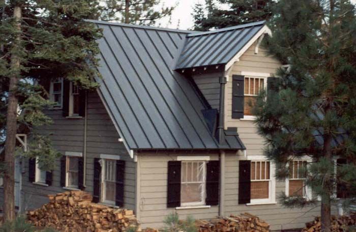 A tan light and black tan roof and white windows