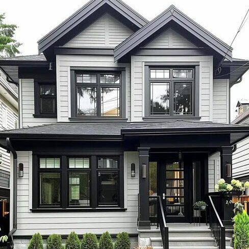 A modern house an black trim and glass window and wooden roof 