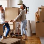 people moving boxes for new home