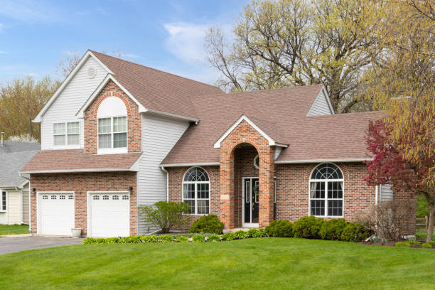 Red brick house and white sliding white garage door