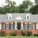 red brick house with charcoal trim featured image