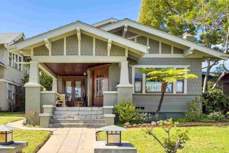 sage green house with black trim featured image