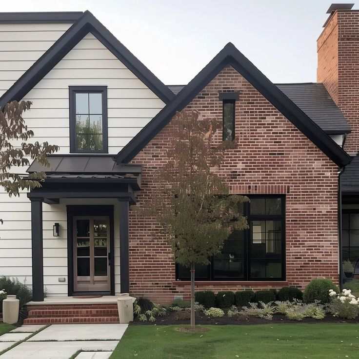 Warm white sidings on red brick and black trim windows