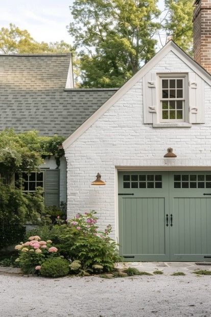 white brick house with light green siding and white trim windwos
