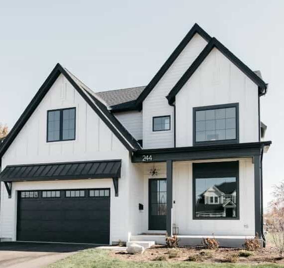 White house with black windows and black trim