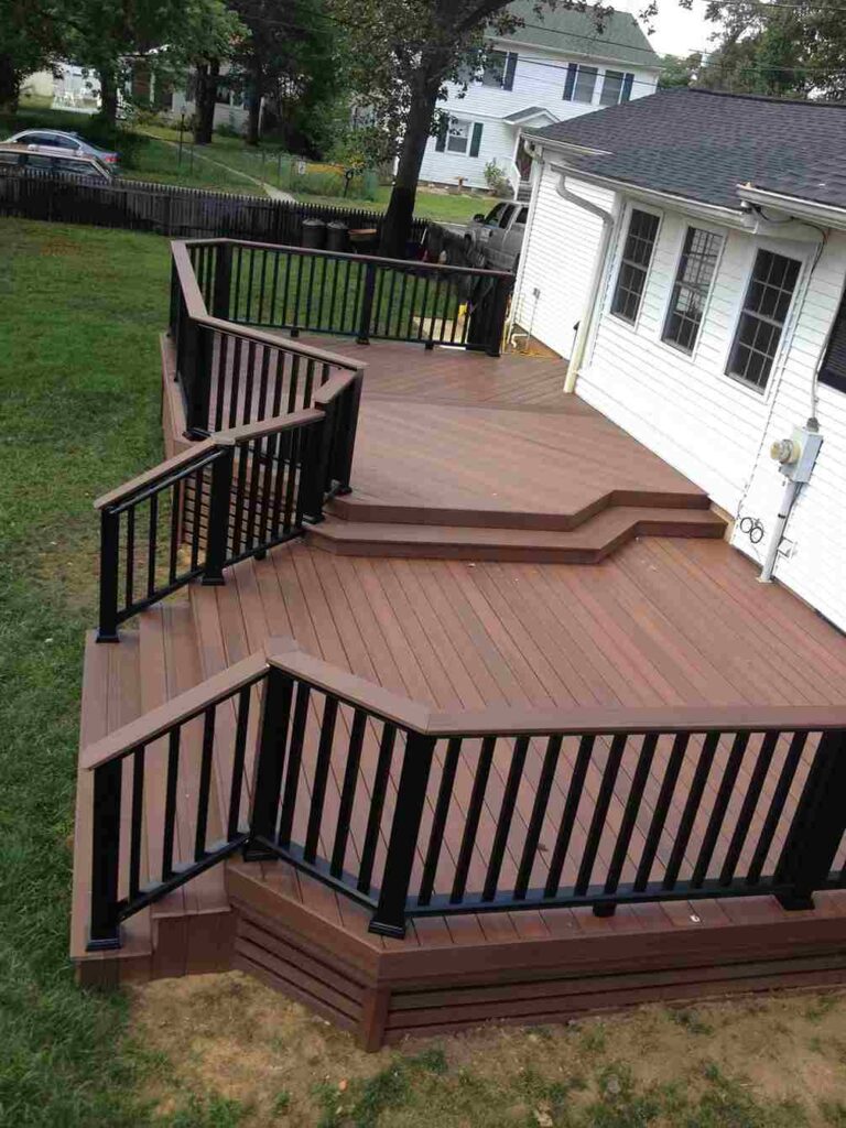 A house with brown deck and brown railing