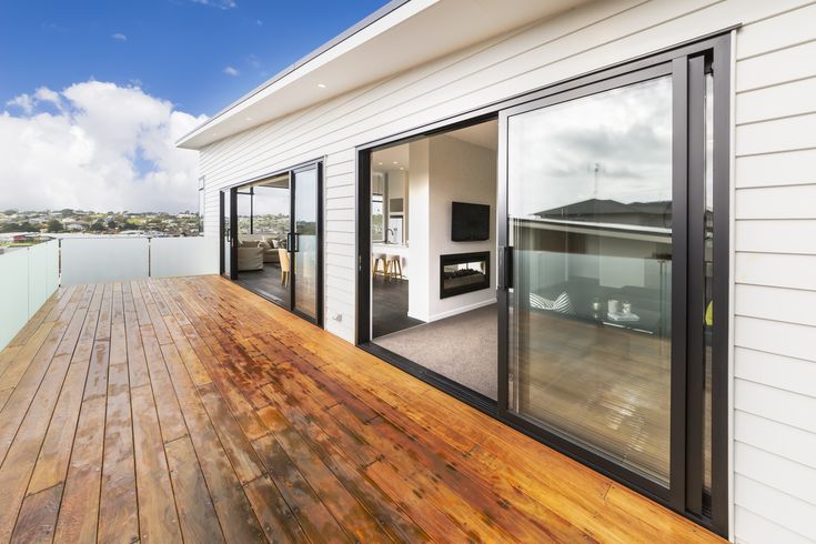 White house with wood decking.